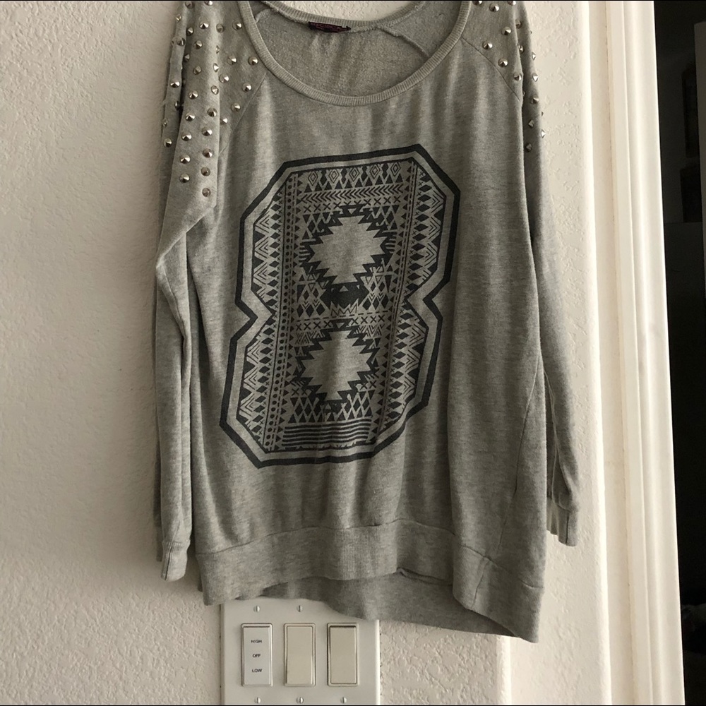 Worn oversized shoulder studded sweater.